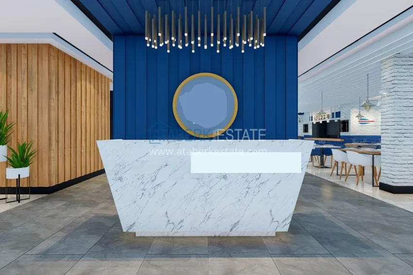 Двухкомнатная квартира в центре Алании с частичным видом на море в строящемся комплексе  19 