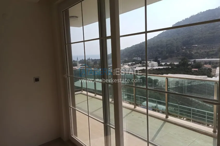 Приобрести Виллы в Кемере, район Кумлуджа с видом на горы и море  15 