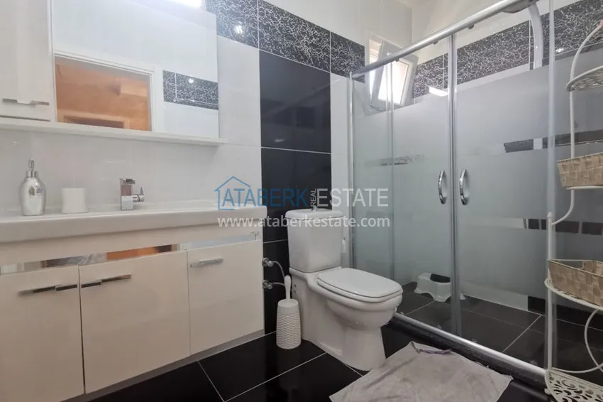 Приобрести Вилла в районе Демирташ с мебелью, садиком и великолепным видом на море  23 