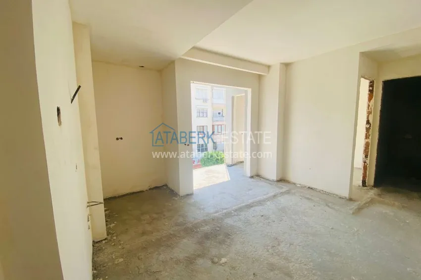 Приобрести Двухкомнатная квартира в центре Алании с частичным видом на море в строящемся комплексе  4 