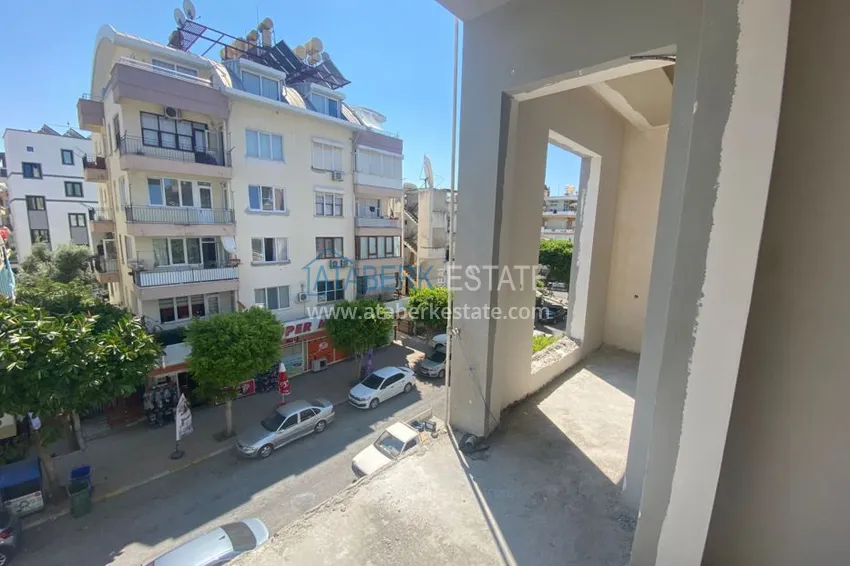 Приобрести Двухкомнатная квартира в центре Алании с частичным видом на море в строящемся комплексе  7 