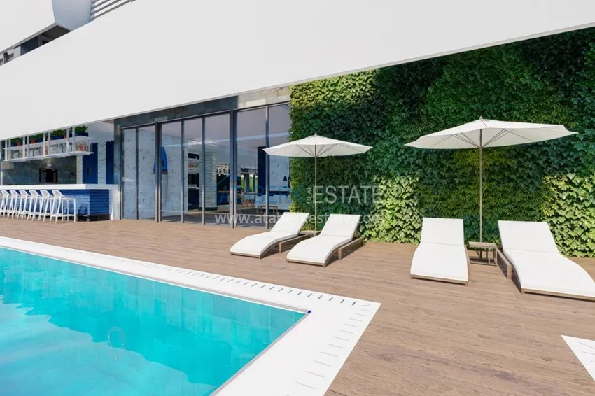 Двухкомнатная квартира в центре Алании с частичным видом на море в строящемся комплексе  7 