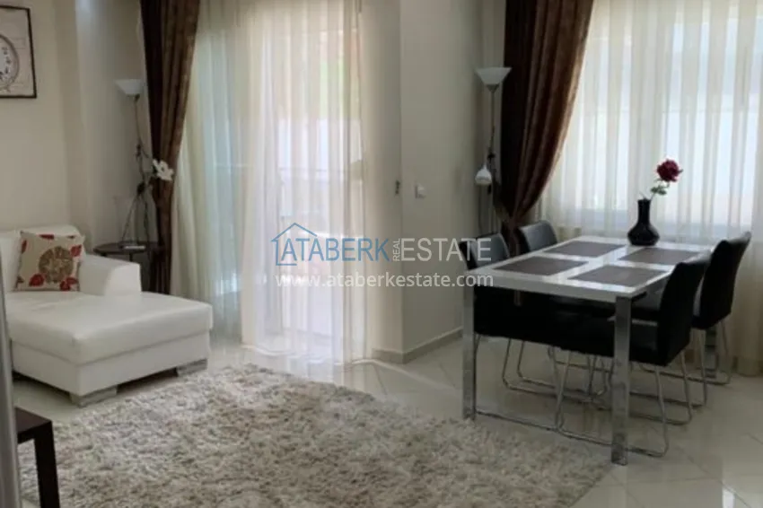 Приобрести Трехкомнатная квартира в Алании с мебелью в районе пляжа Клеопатра 10 