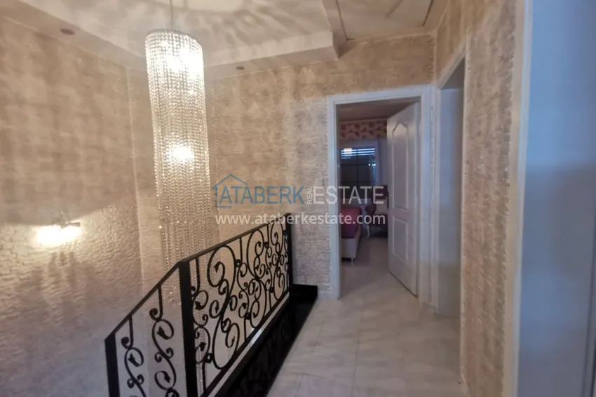 Приобрести Вилла в районе Демирташ с мебелью, садиком и великолепным видом на море  12 