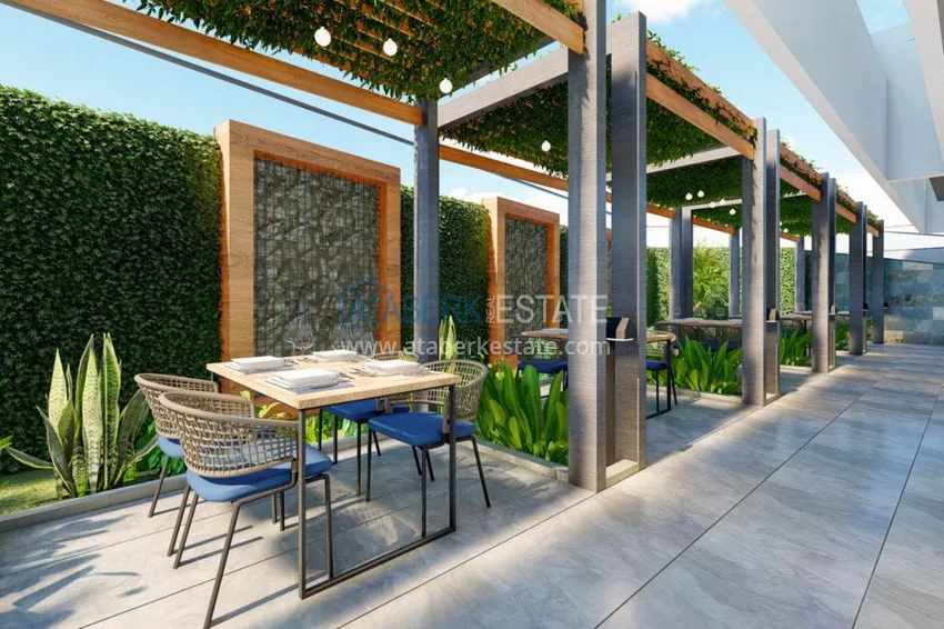 Двухкомнатная квартира в центре Алании с частичным видом на море в строящемся комплексе  9 