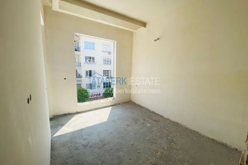 Приобрести Двухкомнатная квартира в центре Алании с частичным видом на море в строящемся комплексе  13 