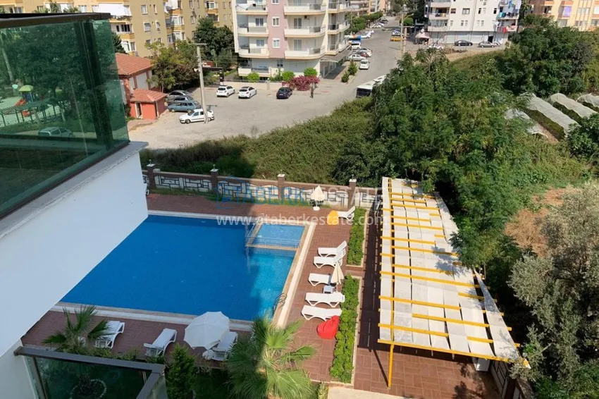 Приобрести Квартира в Махмутларе, с мебелью в современном комплексе 9 