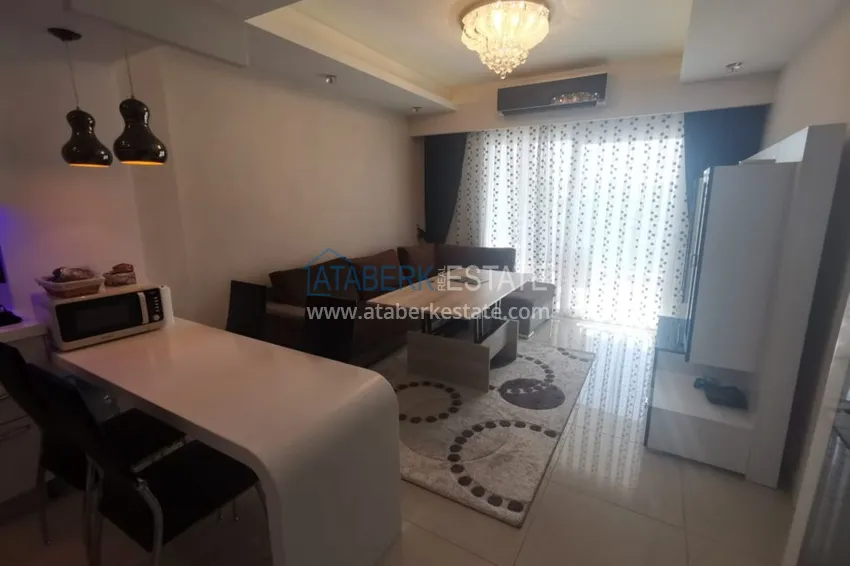 Приобрести Аренда квартиры в Алании, Махмутлар в престижном комплексе с частным пляжем А156  11 