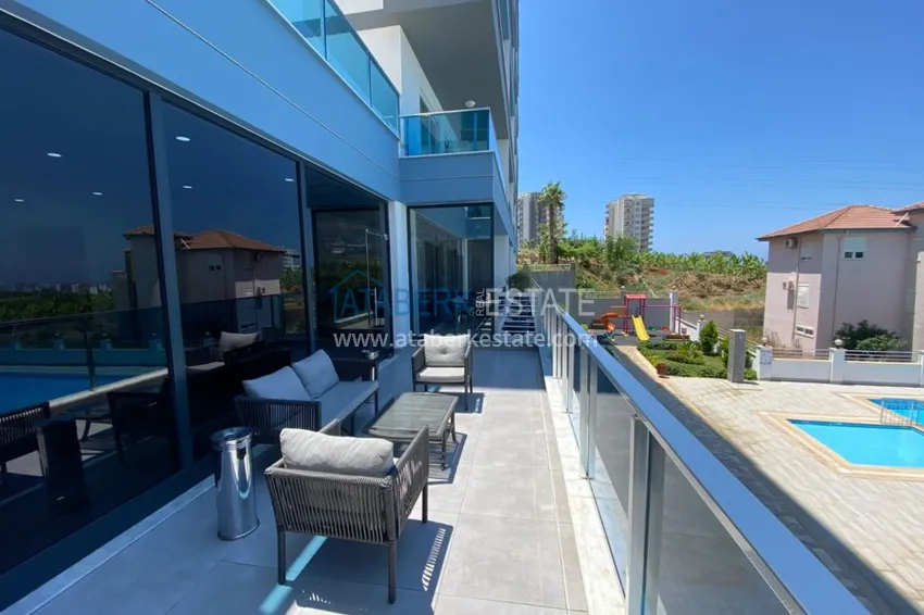 Приобрести Квартира в Махмутларе с новой мебелью в молодом комфортабельном комплексе 11 