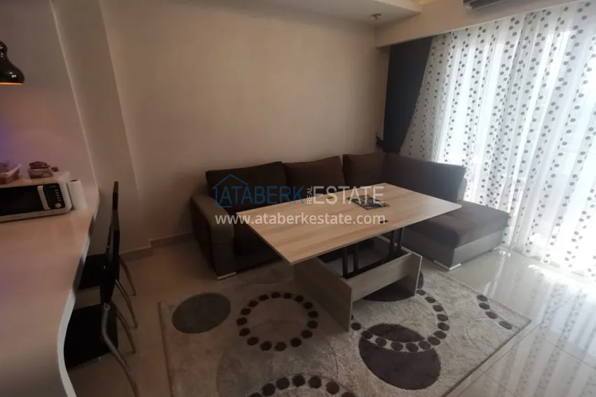 Приобрести Аренда квартиры в Алании, Махмутлар в престижном комплексе с частным пляжем А156  14 