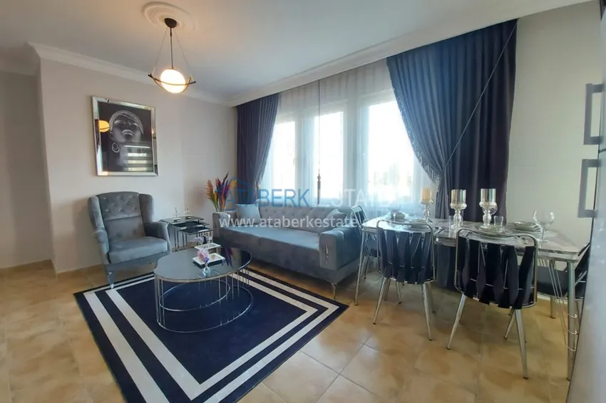 Приобрести Квартира в Махмутларе, с мебелью в жилом доме 1 