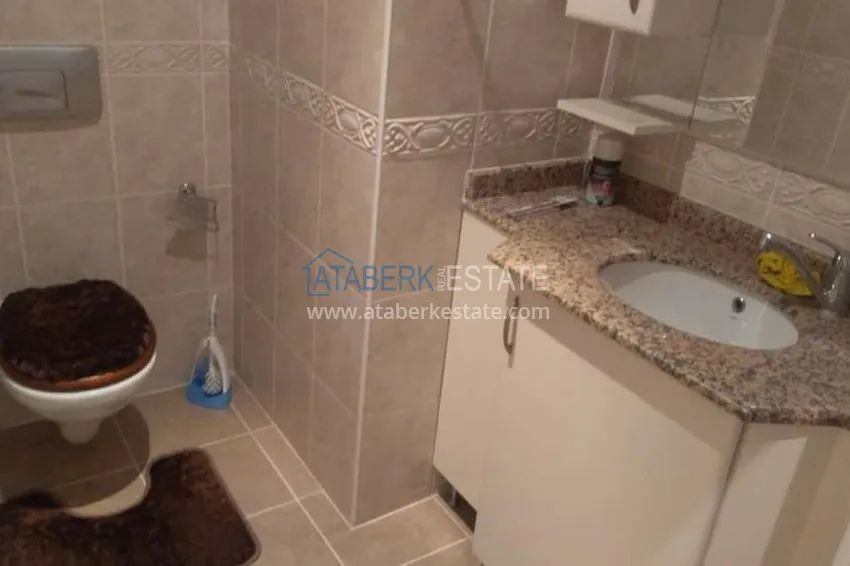 Приобрести Квартира в центре Алании, трехкомнатная с мебелью и застекленным балконом 12 