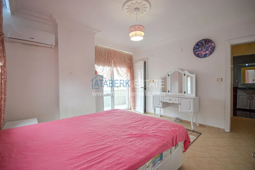 Приобрести Трехкомнатные апартаменты с мебелью в центре курортного городка в Махмутларе 14 