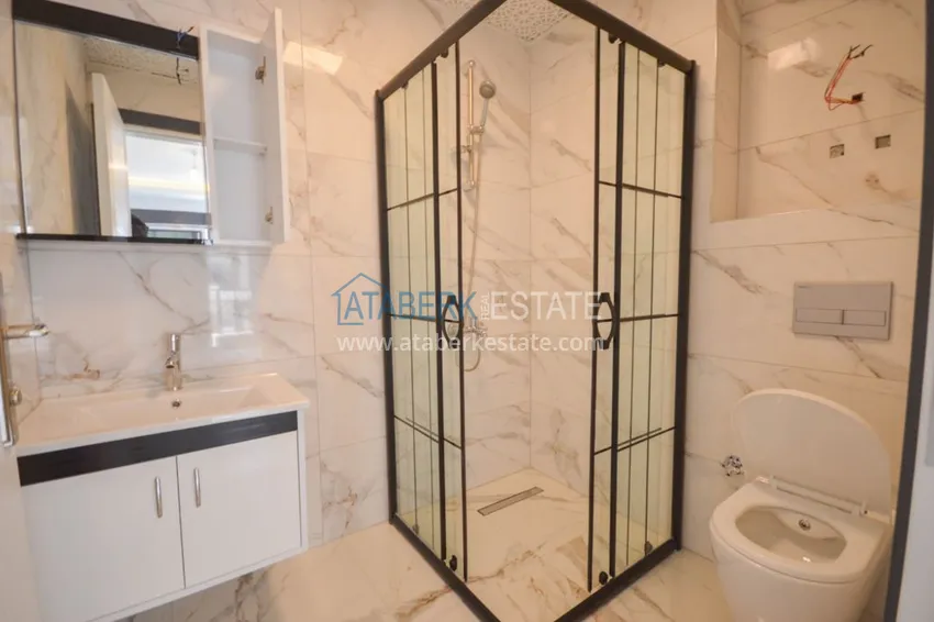 Приобрести Новостройки Алании – квартира в центре Махмутлара, с чистовой отделкой 16 