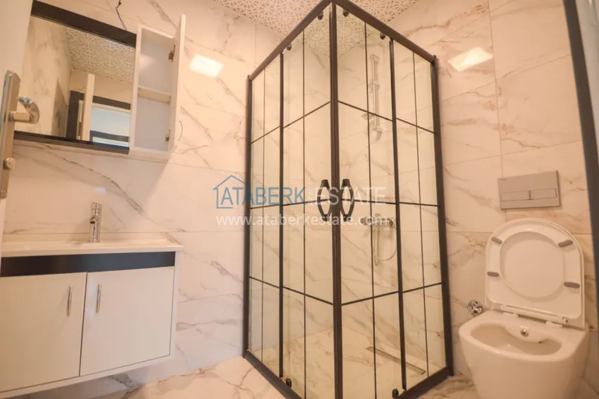 Приобрести Новостройки Алании – квартира в центре Махмутлара, с чистовой отделкой 21 