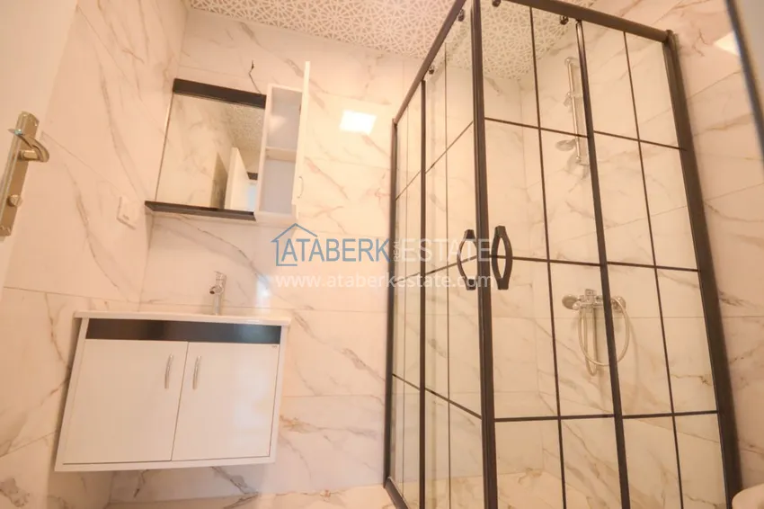 Приобрести Новостройки Алании – квартира в центре Махмутлара, с чистовой отделкой 22 