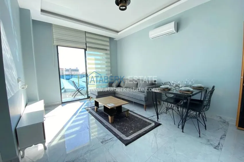 Приобрести Квартира в Махмутларе с новой мебелью в комплексе с бассейном  3 