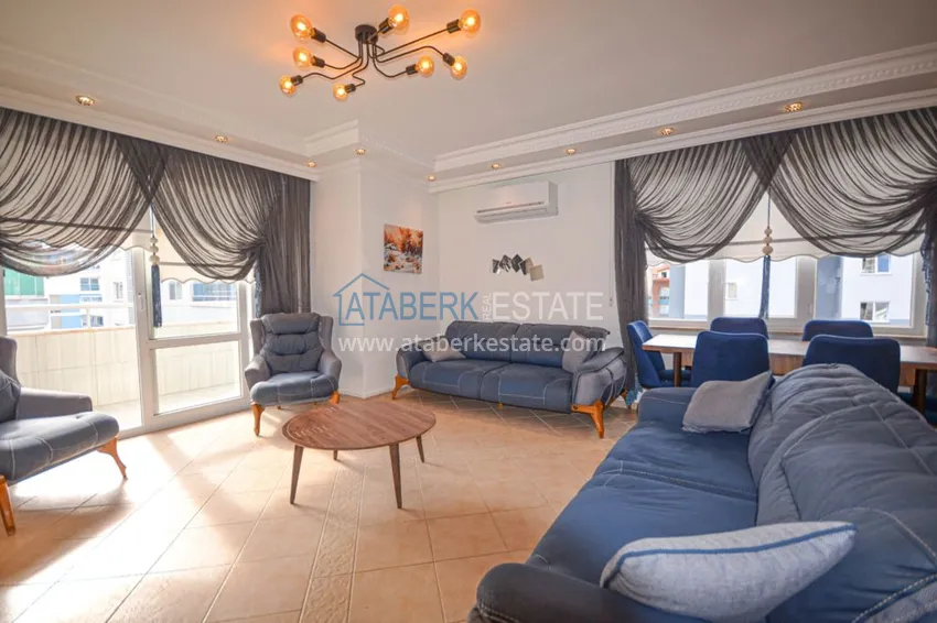 Приобрести Трехкомнатные апартаменты с мебелью в центре курортного городка в Махмутларе 3 