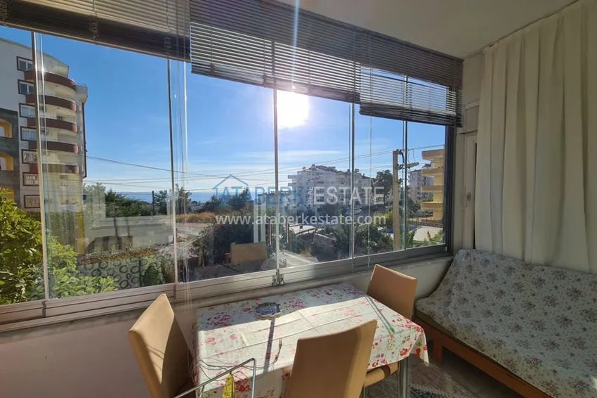 Двухкомнатная квартира в районе Авсаллар с видом на море, балкон застеклен 1 