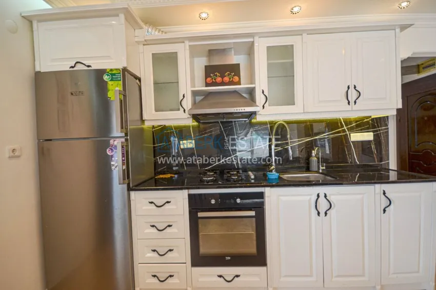 Приобрести Трехкомнатные апартаменты с мебелью в центре курортного городка в Махмутларе 6 