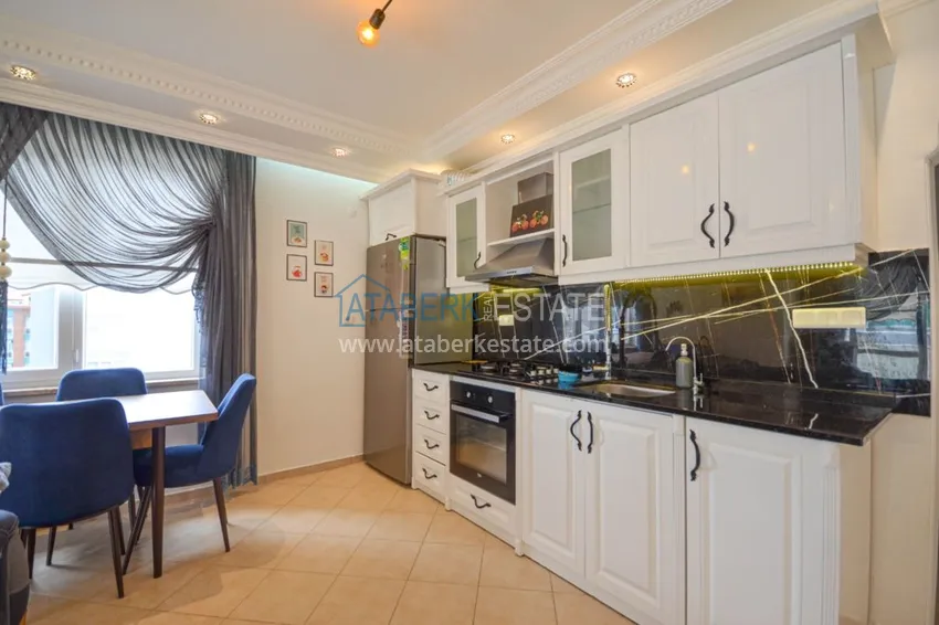 Приобрести Трехкомнатные апартаменты с мебелью в центре курортного городка в Махмутларе 7 