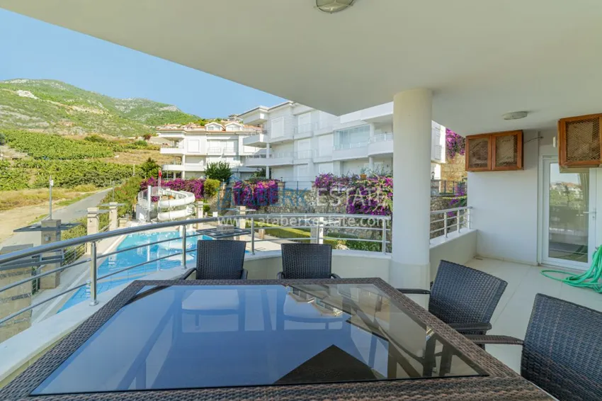 Приобрести Садовый дуплекс в районе Джикджилли с мебелью в жилом комплексе класса-люкс 7 