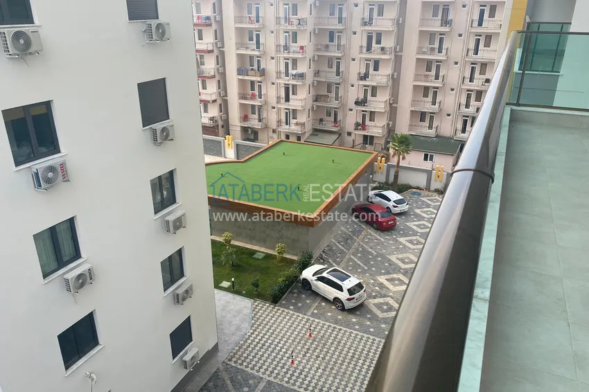 Приобрести Квартира в Махмутларе с чистовой отделкой в новом комплексе, на первой береговой 15 