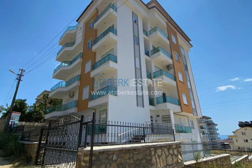 Квартира в районе Авсаллар с чистовой отделкой и видом на горы 1 