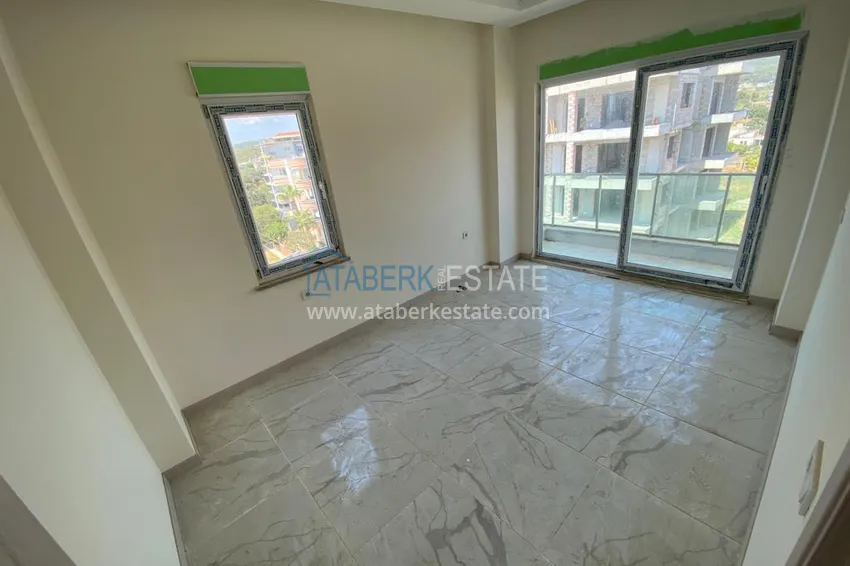 Приобрести Квартира в районе Авсаллар с чистовой отделкой и видом на горы 9 