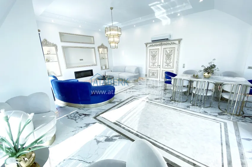 Приобрести Видовой двухуровневый пентхаус с авторским интерьером в районе Махмутлар 10 