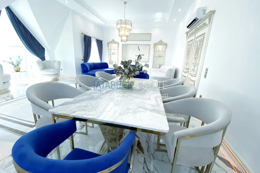 Приобрести Видовой двухуровневый пентхаус с авторским интерьером в районе Махмутлар 11 