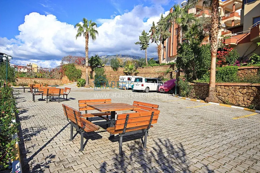 Двухуровневая квартира в Махмутларе с мебелью и отдельной кухней 11 