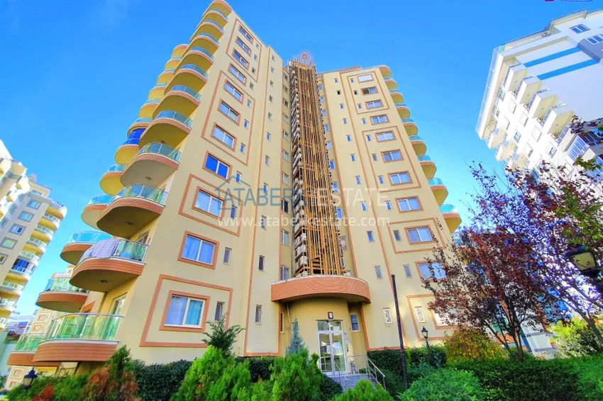 Квартира в Махмутларе с мебелью, застекленным балконом и видом на море  15 