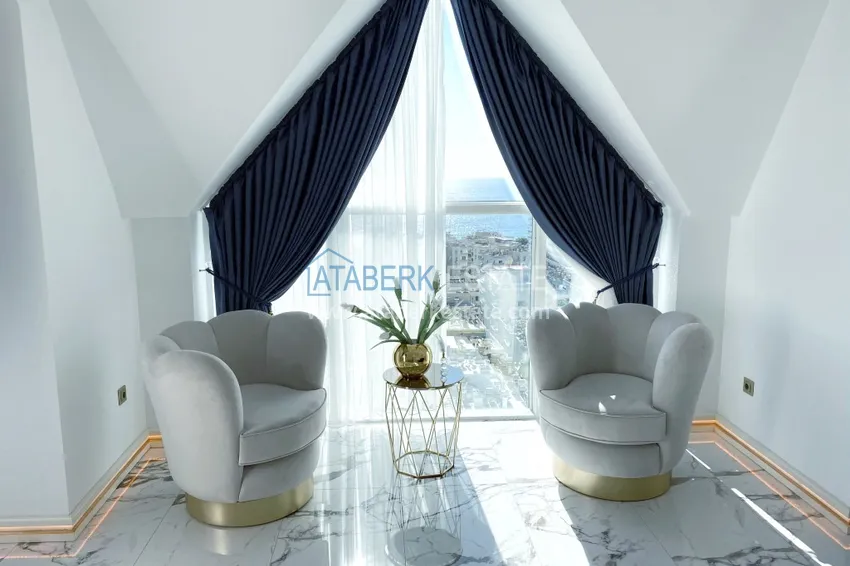 Приобрести Видовой двухуровневый пентхаус с авторским интерьером в районе Махмутлар 14 