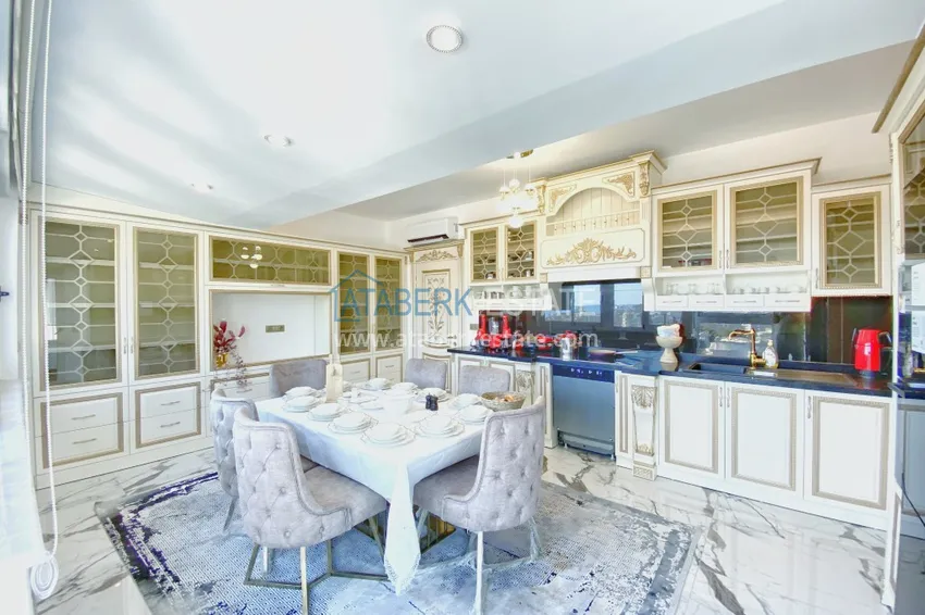 Приобрести Видовой двухуровневый пентхаус с авторским интерьером в районе Махмутлар 15 