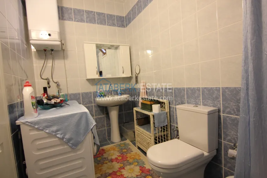 Приобрести Двухуровневая квартира в Махмутларе с мебелью и отдельной кухней 16 