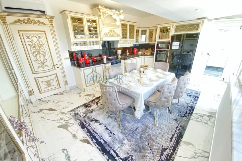 Приобрести Видовой двухуровневый пентхаус с авторским интерьером в районе Махмутлар 17 