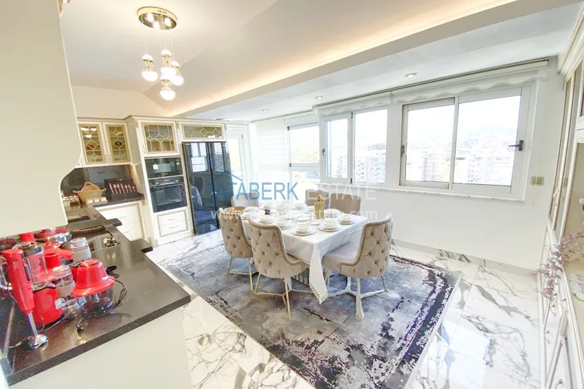 Приобрести Видовой двухуровневый пентхаус с авторским интерьером в районе Махмутлар 18 