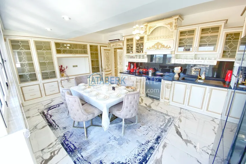 Приобрести Видовой двухуровневый пентхаус с авторским интерьером в районе Махмутлар 19 