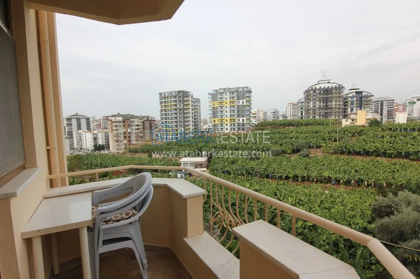 Приобрести Двухуровневая квартира в Махмутларе с мебелью и отдельной кухней 20 