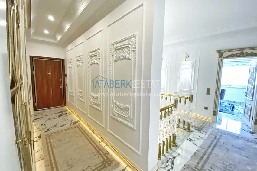 Приобрести Видовой двухуровневый пентхаус с авторским интерьером в районе Махмутлар 1 