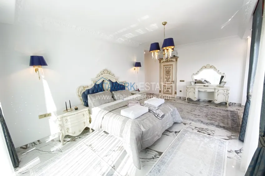 Приобрести Видовой двухуровневый пентхаус с авторским интерьером в районе Махмутлар 23 