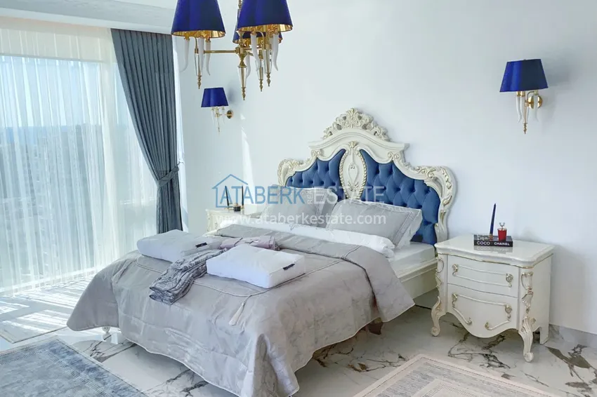 Приобрести Видовой двухуровневый пентхаус с авторским интерьером в районе Махмутлар 25 