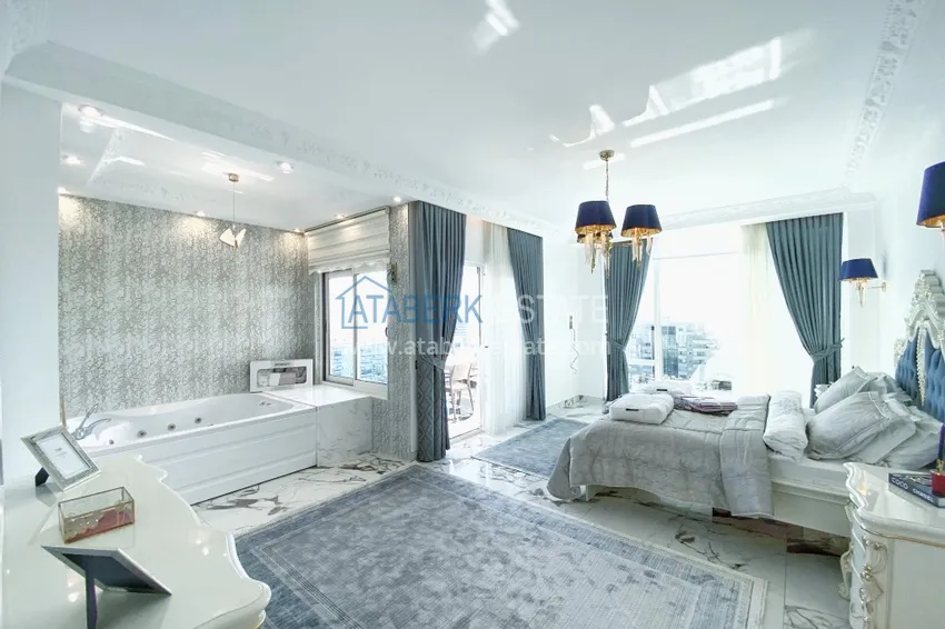 Приобрести Видовой двухуровневый пентхаус с авторским интерьером в районе Махмутлар 27 