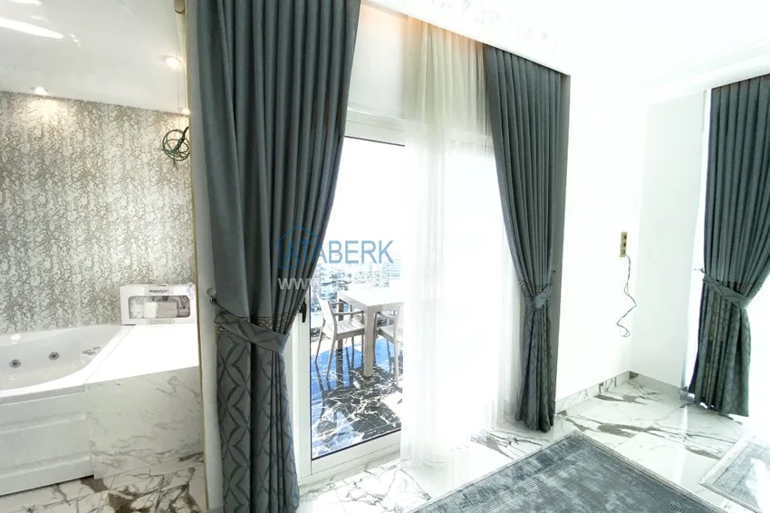 Приобрести Видовой двухуровневый пентхаус с авторским интерьером в районе Махмутлар 29 