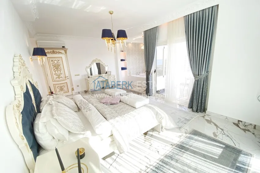 Приобрести Видовой двухуровневый пентхаус с авторским интерьером в районе Махмутлар 35 