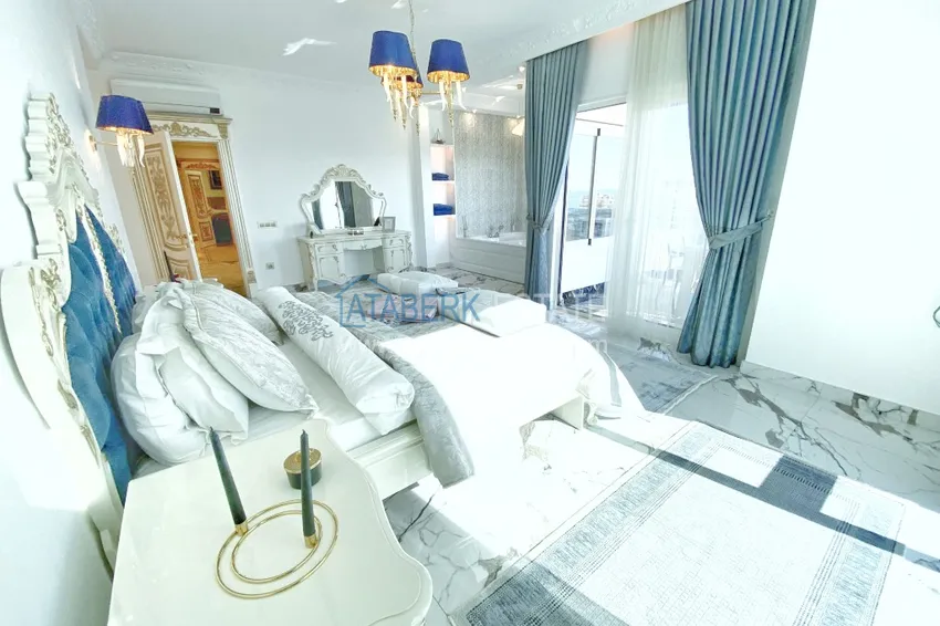 Приобрести Видовой двухуровневый пентхаус с авторским интерьером в районе Махмутлар 36 