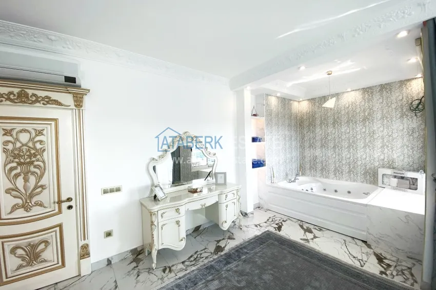 Приобрести Видовой двухуровневый пентхаус с авторским интерьером в районе Махмутлар 37 