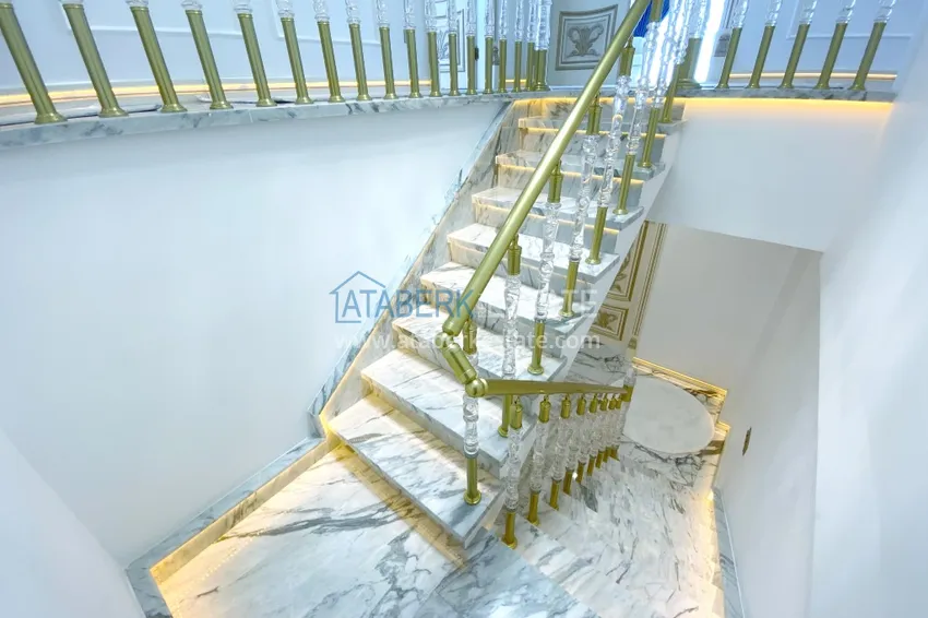 Приобрести Видовой двухуровневый пентхаус с авторским интерьером в районе Махмутлар 39 