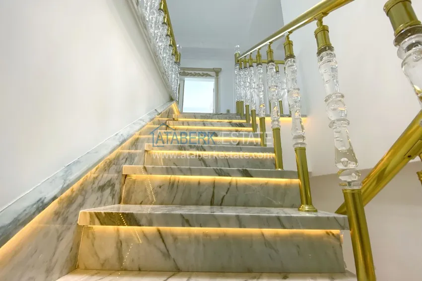 Приобрести Видовой двухуровневый пентхаус с авторским интерьером в районе Махмутлар 41 